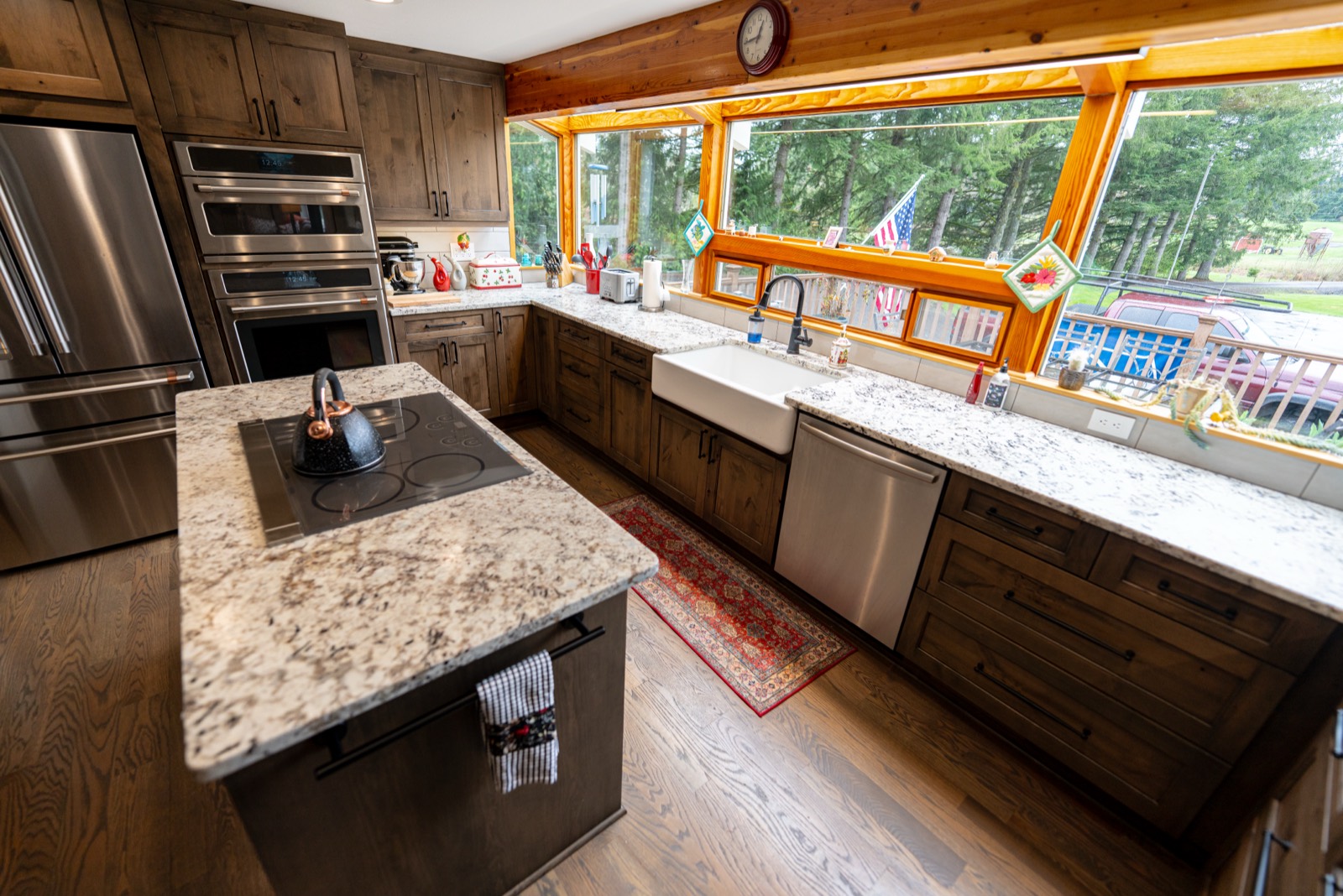 Kitchen remodel with warm wood cabinets and a farmhouse sink